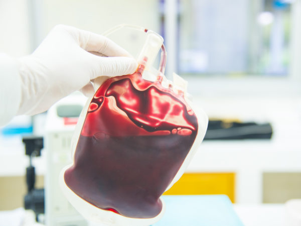 Red Bag of Blood in hand Doctor Red Bag of Blood in hand Doctor